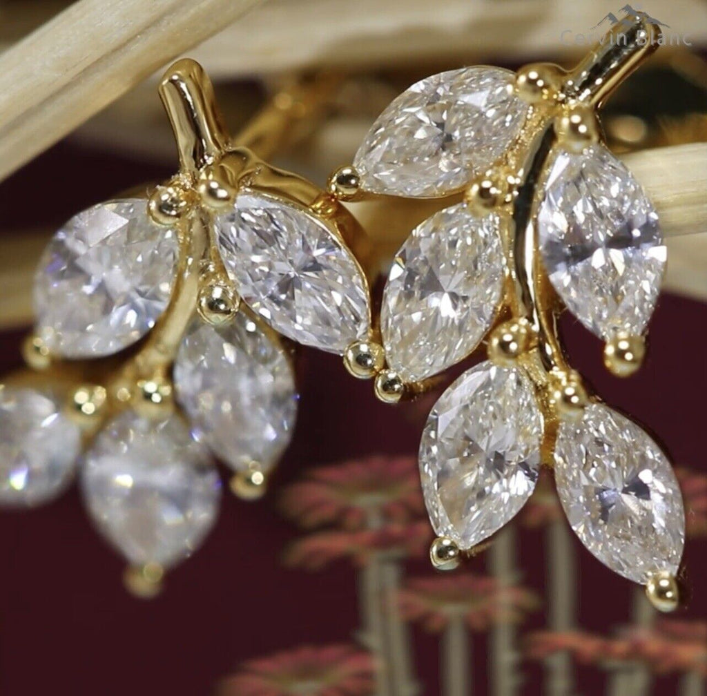 18ct yellow gold diamond earrings, leaf studs 